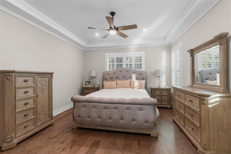 283 London Road Ball Ground, GA 30107 - Photo 27 of 73 a bedroom with a bed and a dresser