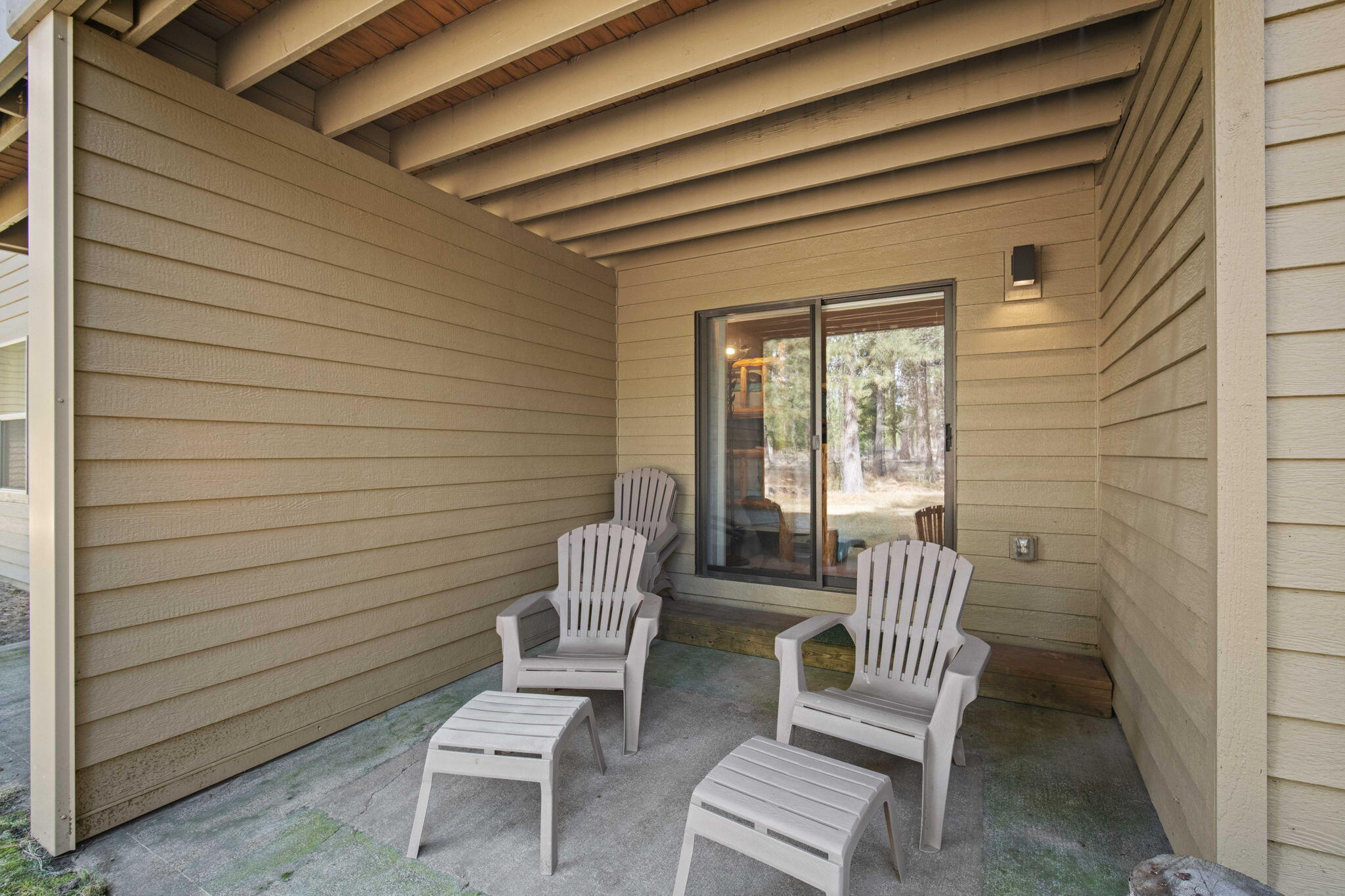 17682 Bittern Lane, Unit 31 Sunriver, OR 97707 - Photo 42 of 44 a view of wooden door and chair in the patio