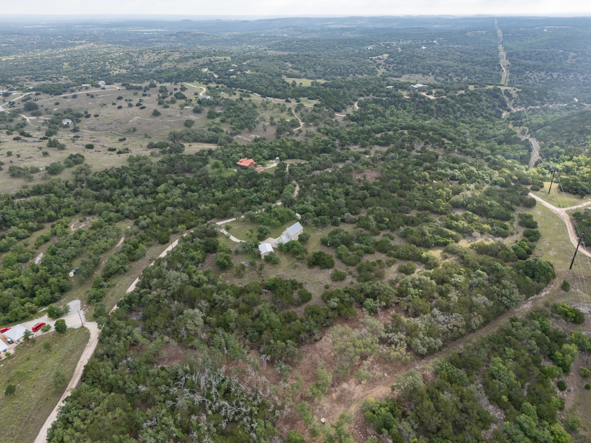 -altwein Rd 17.91 Acres Altwein Road Blanco, TX 78606 - Photo 8 of 33 an aerial view of house with yard and mountain view in back