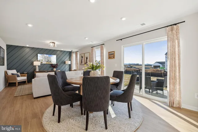 a view of a livingroom with furniture window and wooden floor