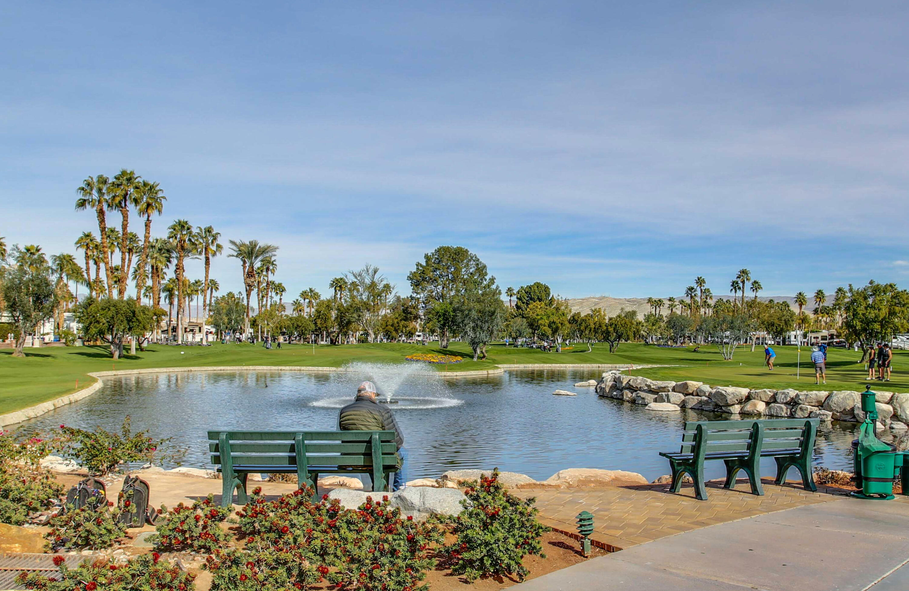 69411 Ramon Road, Unit 839 Cathedral City, CA 92234 - Photo 21 of 50 a view of a lake with a table and a chairs