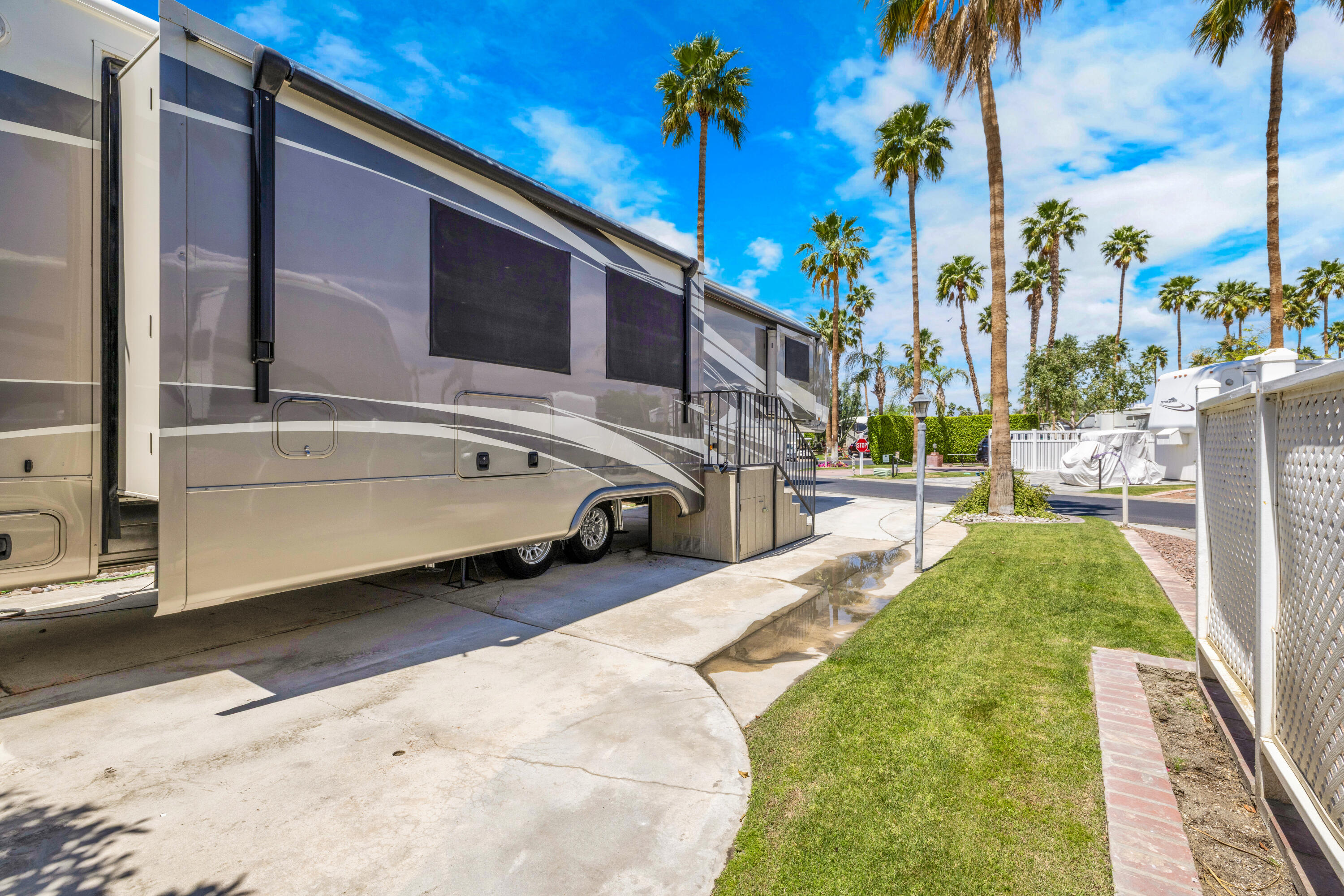 69411 Ramon Road, Unit 839 Cathedral City, CA 92234 - Photo 9 of 50 a view of a backyard with a car parked in the road