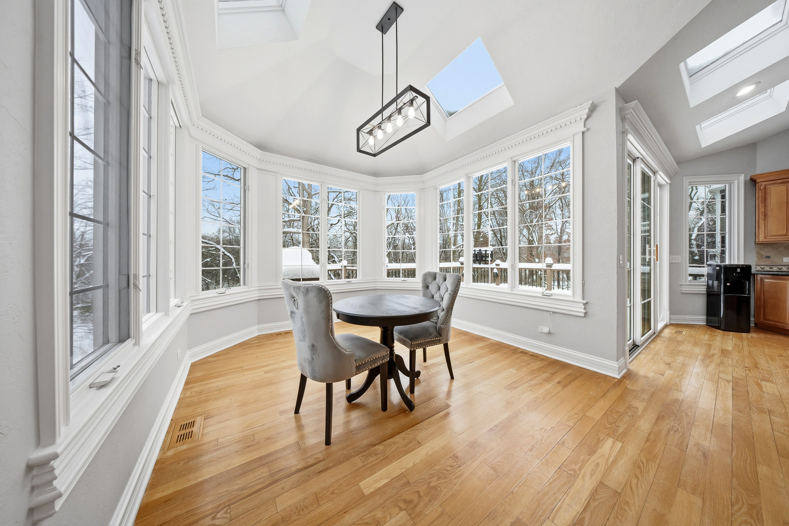 761 Reserve Court South Elgin, IL 60177 - Photo 23 of 89 a view of a dining room with furniture window and wooden floor