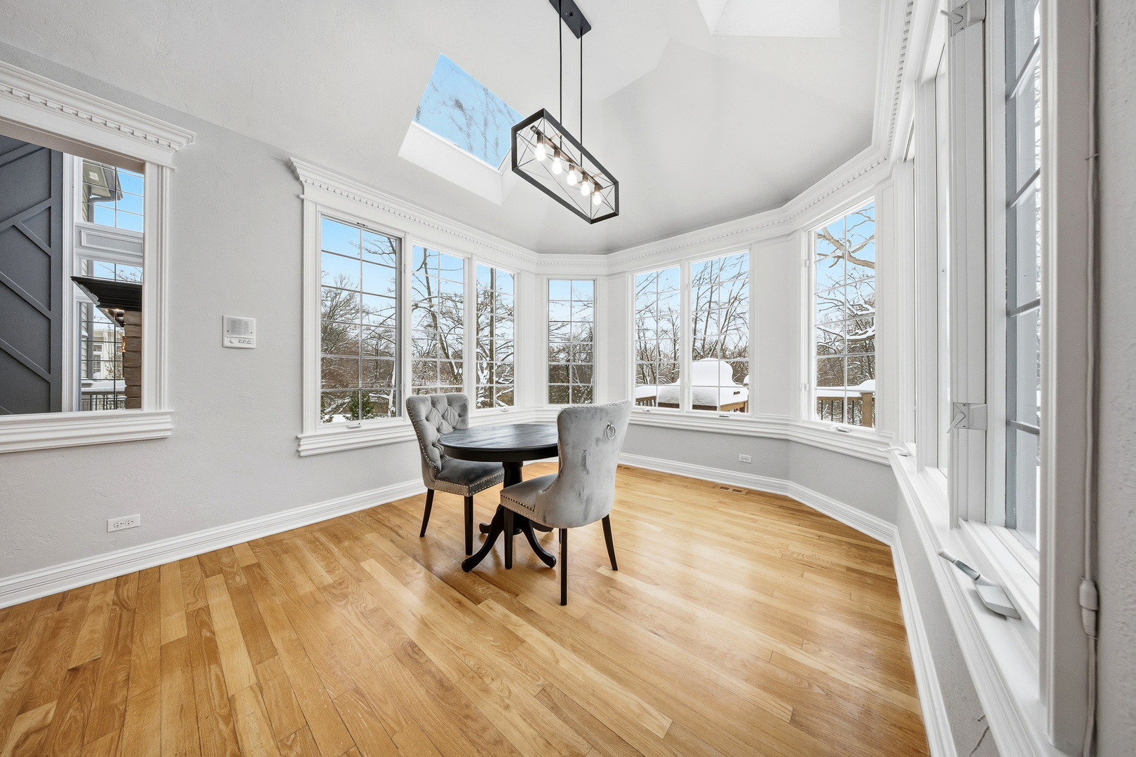 761 Reserve Court South Elgin, IL 60177 - Photo 24 of 89 a view of a dining room with furniture window and wooden floor