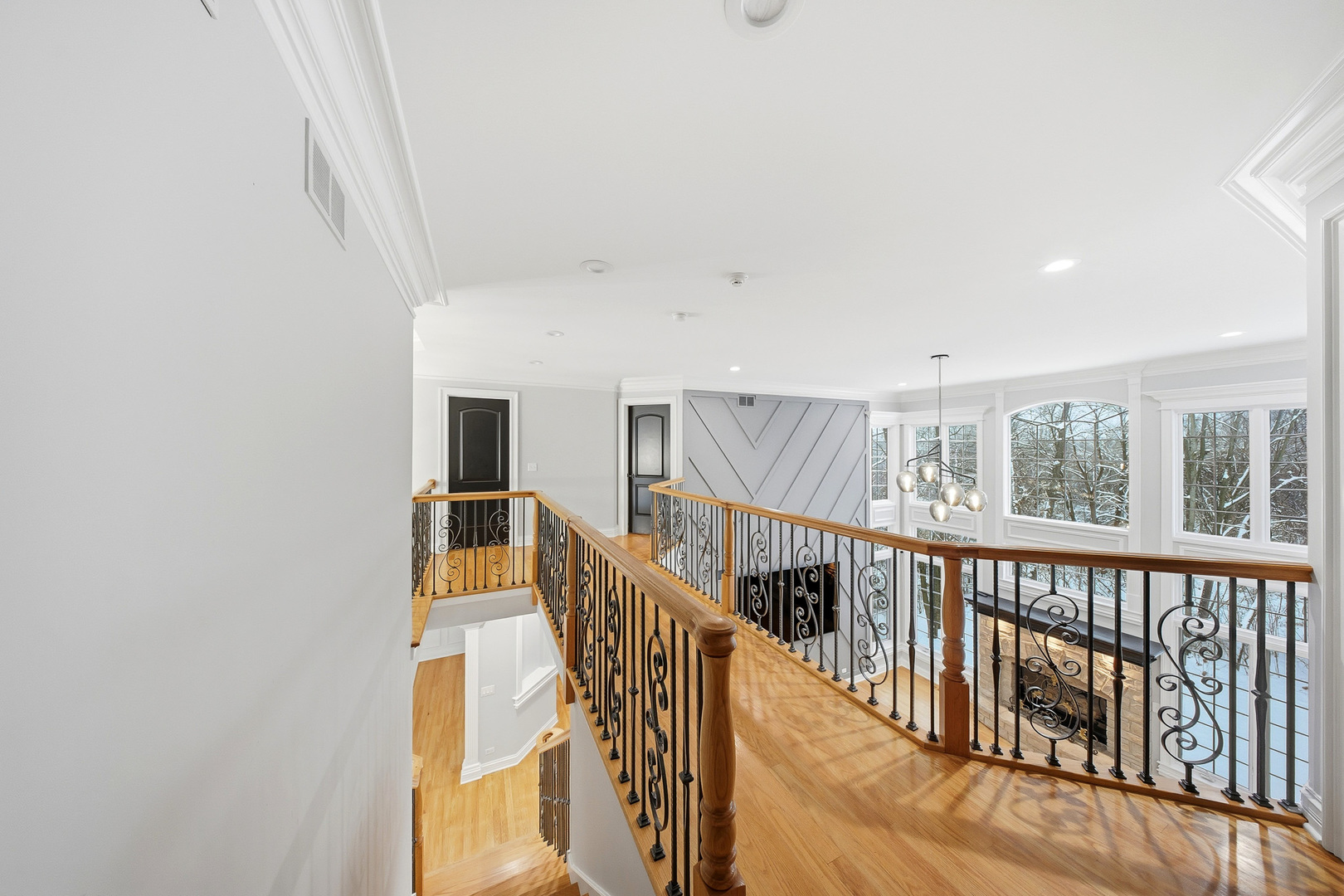 761 Reserve Court South Elgin, IL 60177 - Photo 29 of 89 a view of staircase with lots of frames on wall and windows