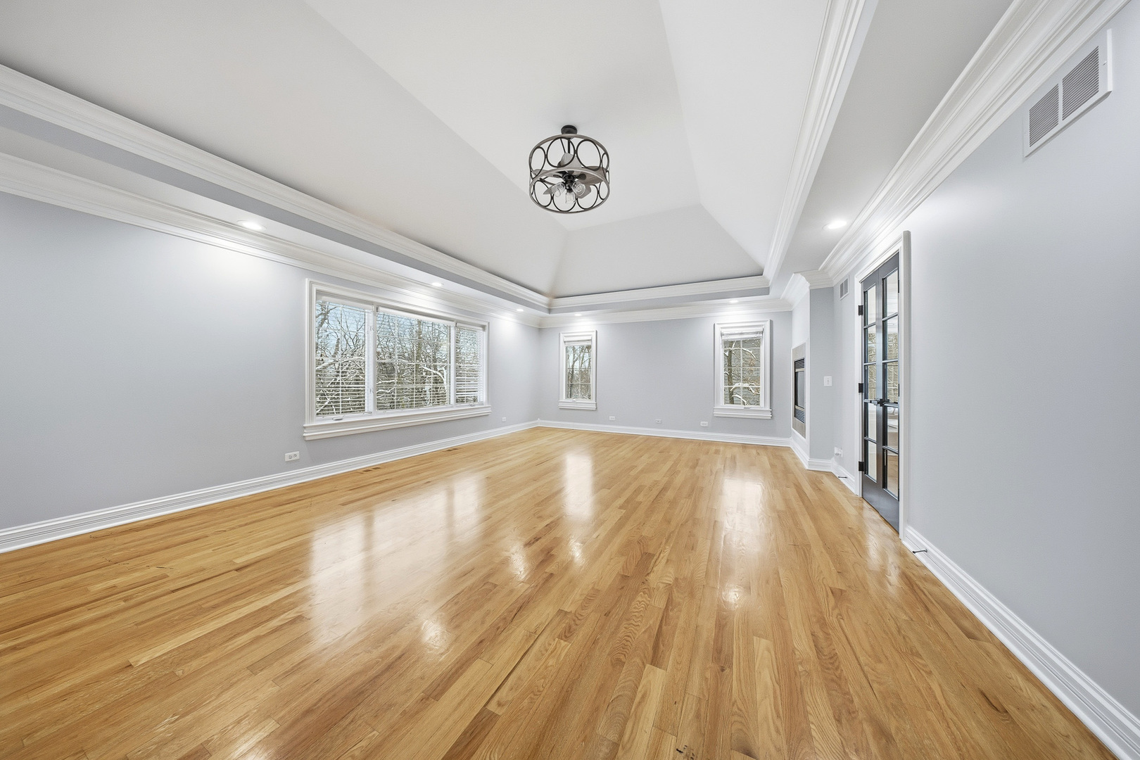 761 Reserve Court South Elgin, IL 60177 - Photo 32 of 89 a view of an empty room with a window and wooden floor