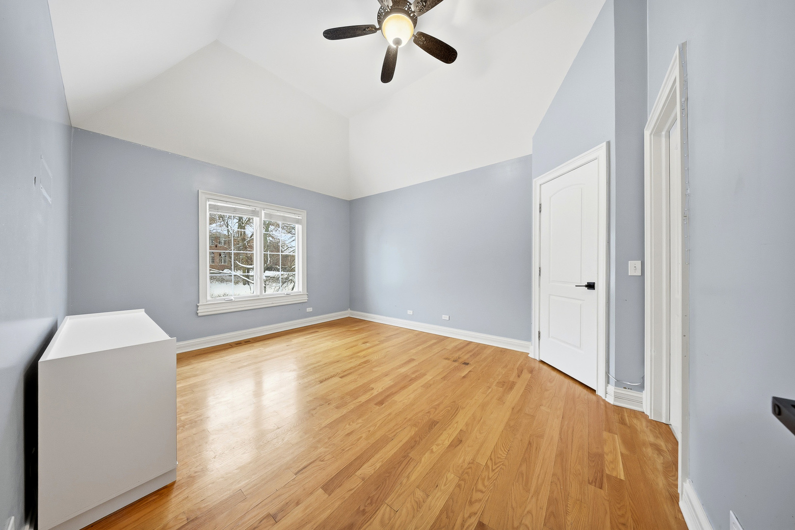 761 Reserve Court South Elgin, IL 60177 - Photo 48 of 89 a view of empty room with wooden floor and fan