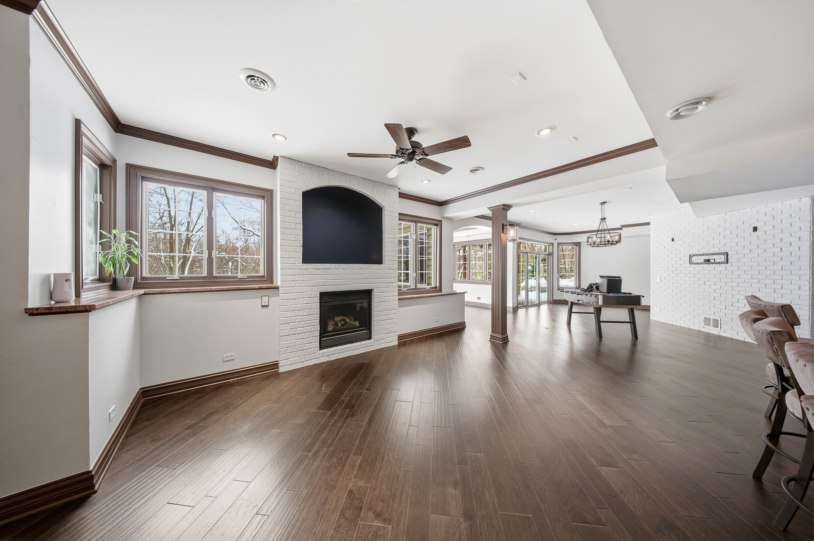 761 Reserve Court South Elgin, IL 60177 - Photo 58 of 89 a view of a livingroom with furniture a ceiling fan and wooden floor