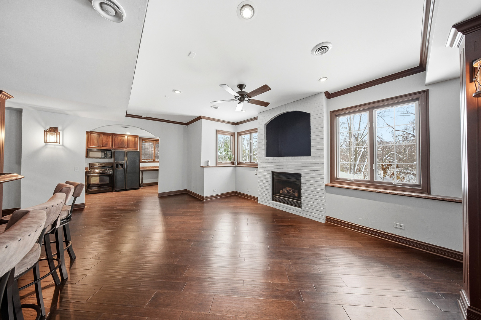 761 Reserve Court South Elgin, IL 60177 - Photo 59 of 89 a view of a livingroom with furniture a ceiling fan and wooden floor