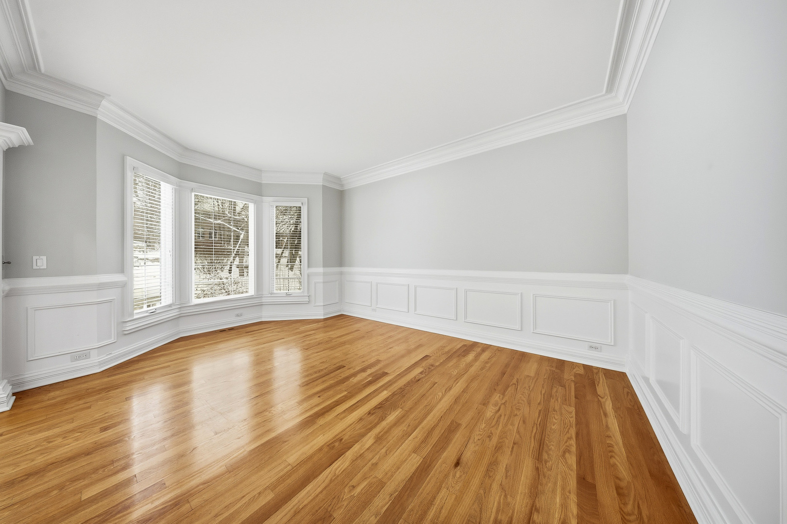 761 Reserve Court South Elgin, IL 60177 - Photo 7 of 89 a view of empty room with wooden floor and fan