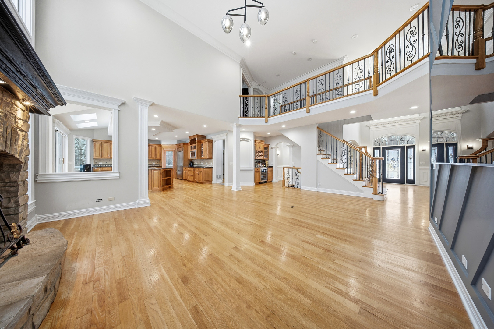 761 Reserve Court South Elgin, IL 60177 - Photo 9 of 89 a view of a hallway with wooden floor and a kitchen