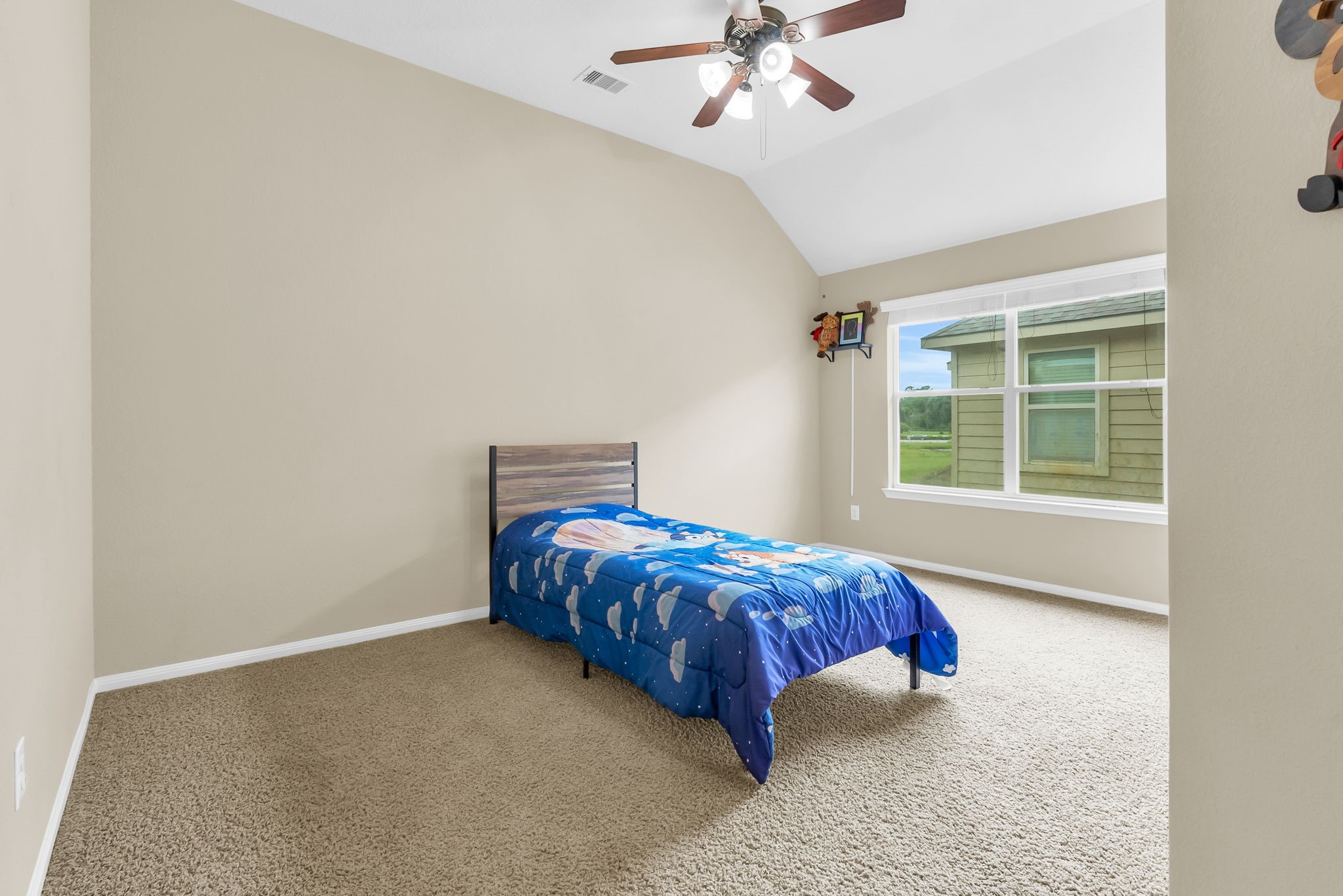 16619 Dover Mills Drive Spring, TX 77379 - Photo 34 of 49 a bed sitting in a room next to a window