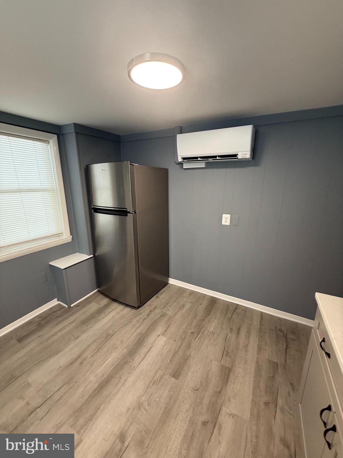 122 West All Saints Street Frederick, MD 21701 - Photo 14 of 23 a view of an empty room with wooden floor and a window
