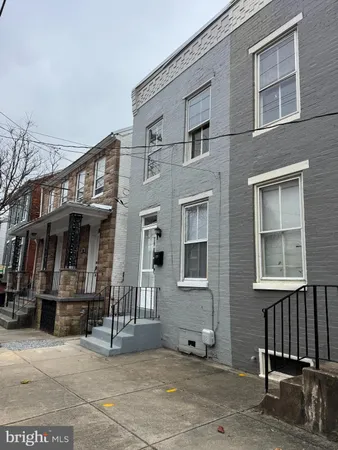 a view of a building with a bench in front of building