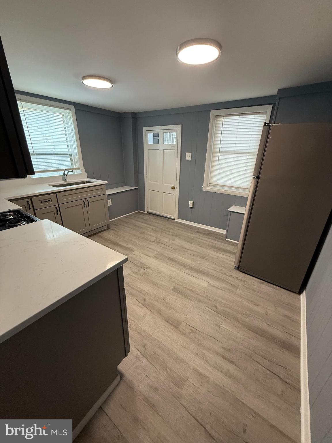 122 West All Saints Street Frederick, MD 21701 - Photo 6 of 23 a view of an empty room with windows & cabinet