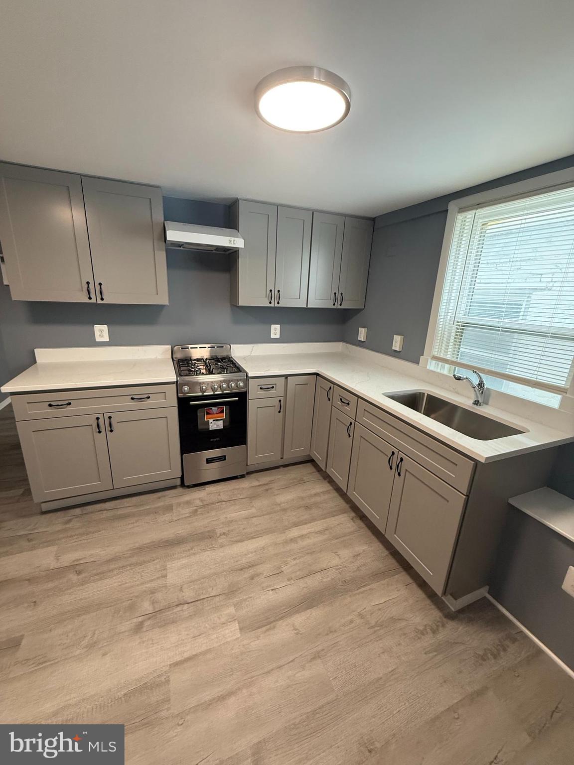 122 West All Saints Street Frederick, MD 21701 - Photo 7 of 23 a kitchen with a sink cabinets and window