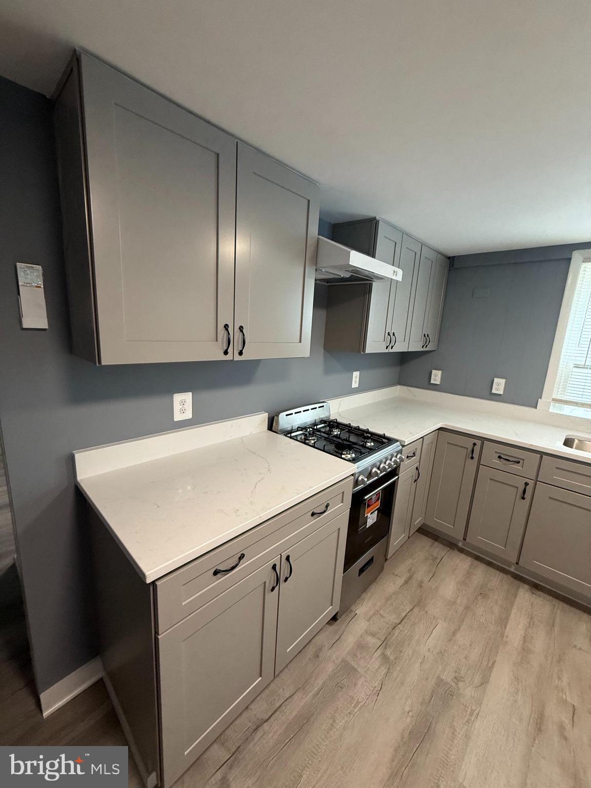 122 West All Saints Street Frederick, MD 21701 - Photo 8 of 23 a kitchen with a sink stove and cabinets