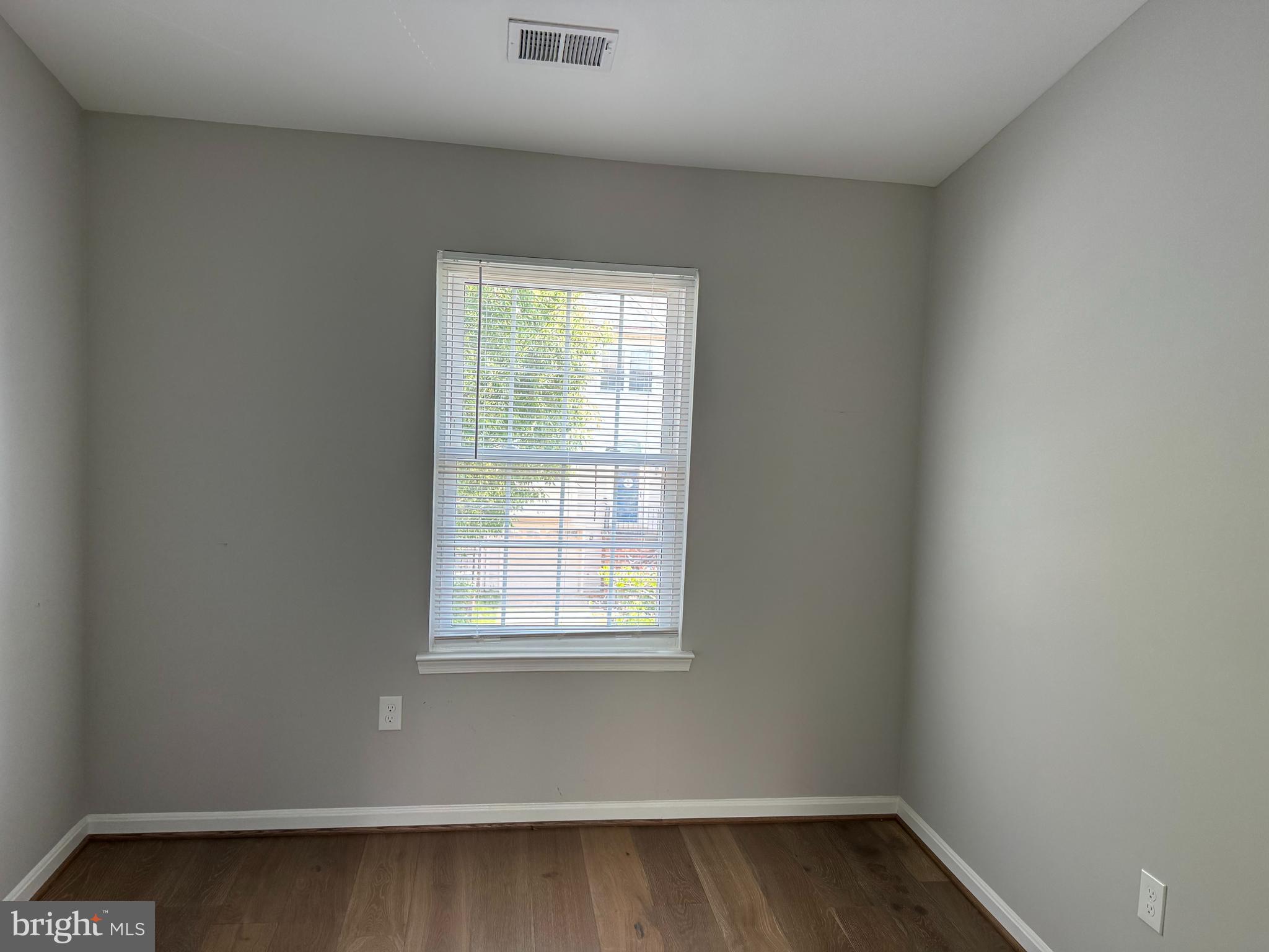6110 George Baylor Drive Centreville, VA 20121 - Photo 7 of 12 a small space with wooden floor and a window