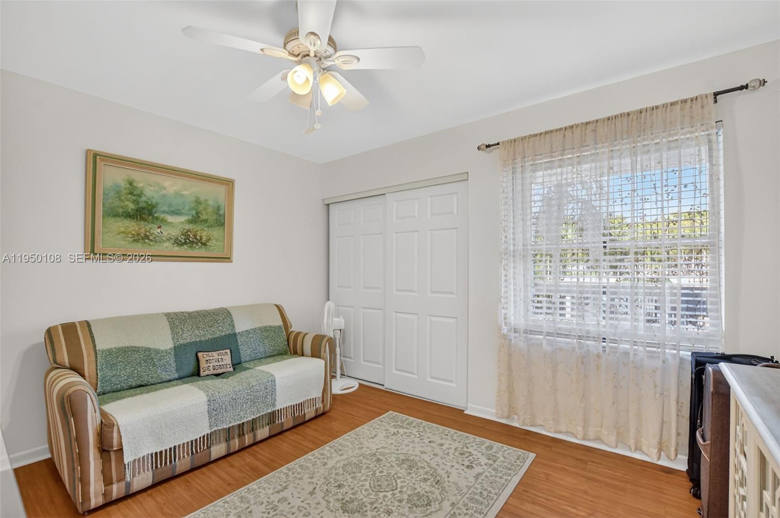 6530 Boca Del Mar Drive, Unit 235 Boca Raton, FL 33433 - Photo 16 of 34 a living room with furniture and a window