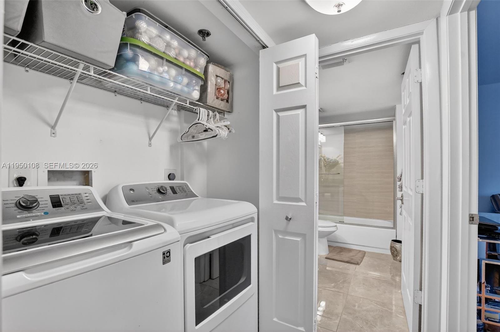 6530 Boca Del Mar Drive, Unit 235 Boca Raton, FL 33433 - Photo 19 of 34 a utility room with dryer and washer
