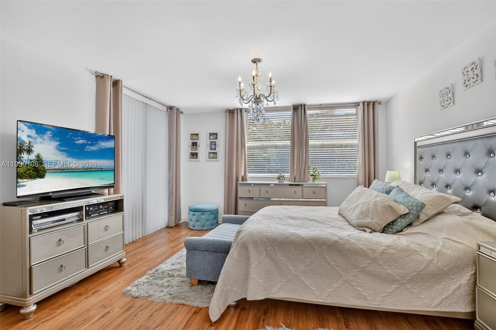 6530 Boca Del Mar Drive, Unit 235 Boca Raton, FL 33433 - Photo 22 of 34 a bedroom with a bed and a flat screen tv