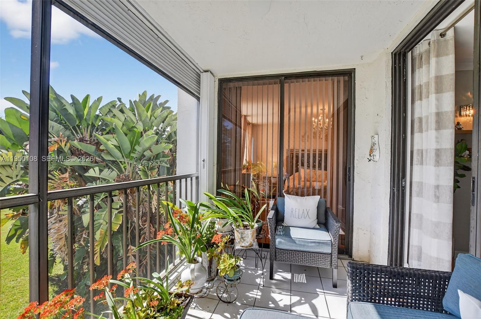 6530 Boca Del Mar Drive, Unit 235 Boca Raton, FL 33433 - Photo 25 of 34 a balcony with potted plants and wooden floor