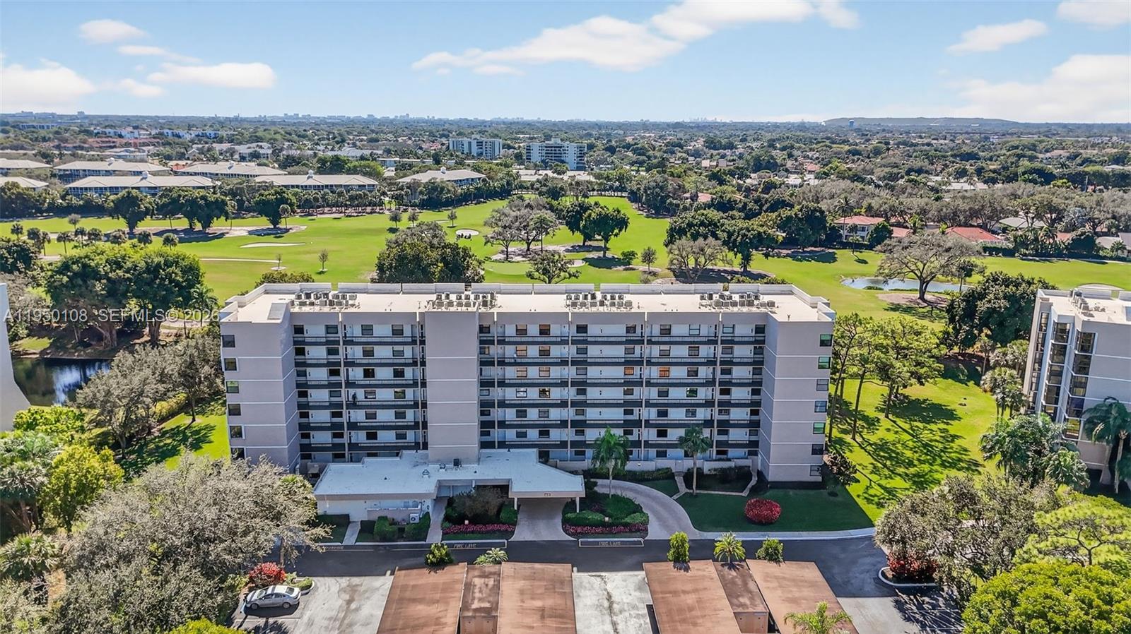 6530 Boca Del Mar Drive, Unit 235 Boca Raton, FL 33433 - Photo 30 of 34 an aerial view of a city with lawn chairs and large trees