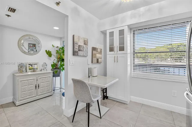 a kitchen with a table and chairs