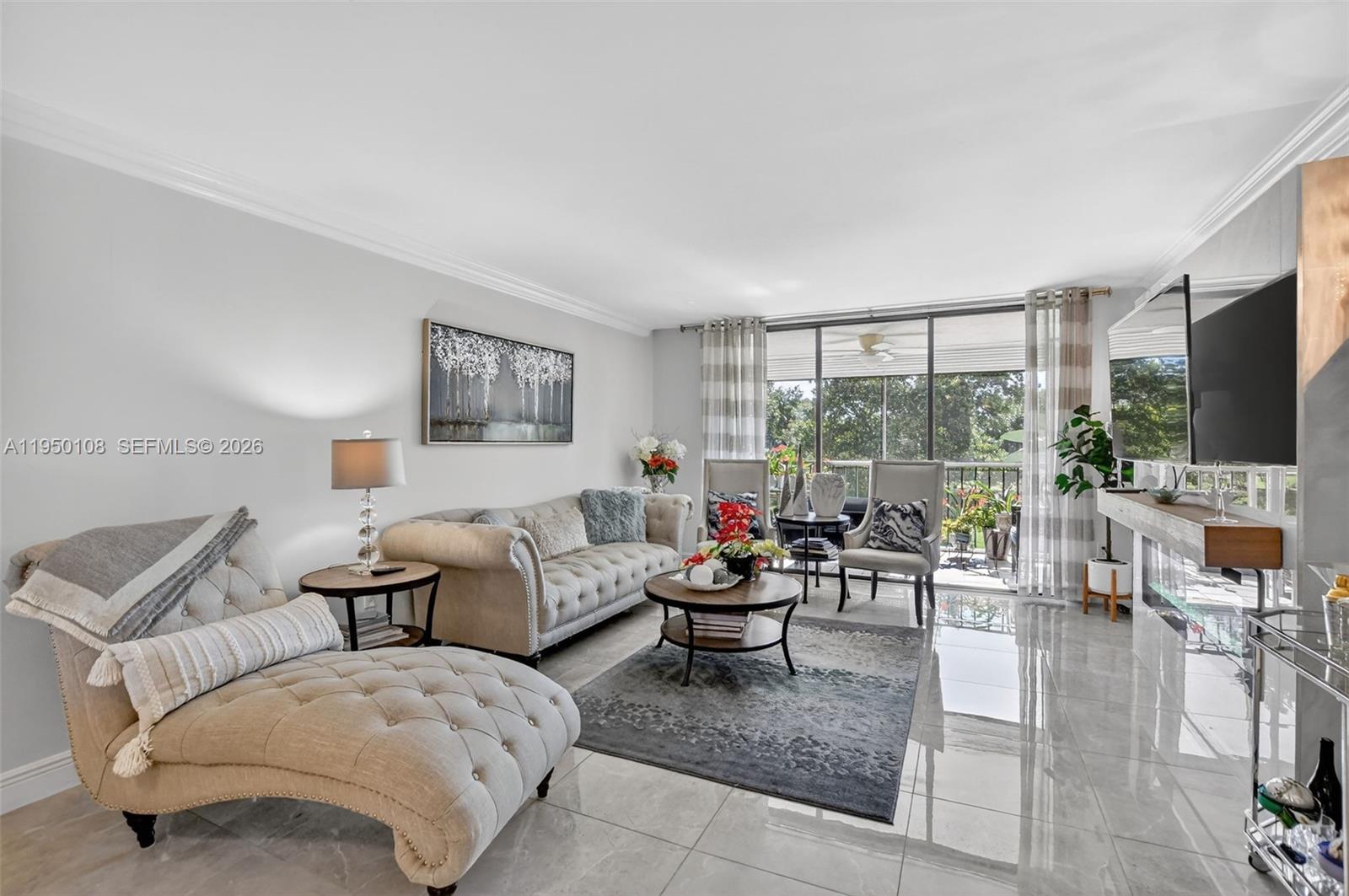 6530 Boca Del Mar Drive, Unit 235 Boca Raton, FL 33433 - Photo 7 of 34 a living room with furniture and a flat screen tv