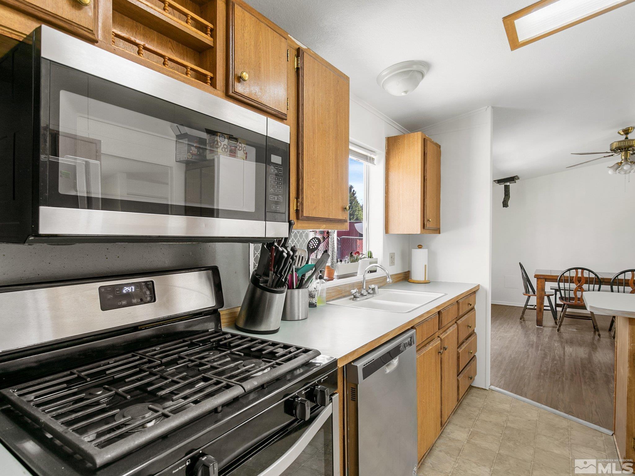 17280 Whippoorwill Lane Reno, NV 89508 - Photo 14 of 26 a stove top oven sitting inside of a kitchen