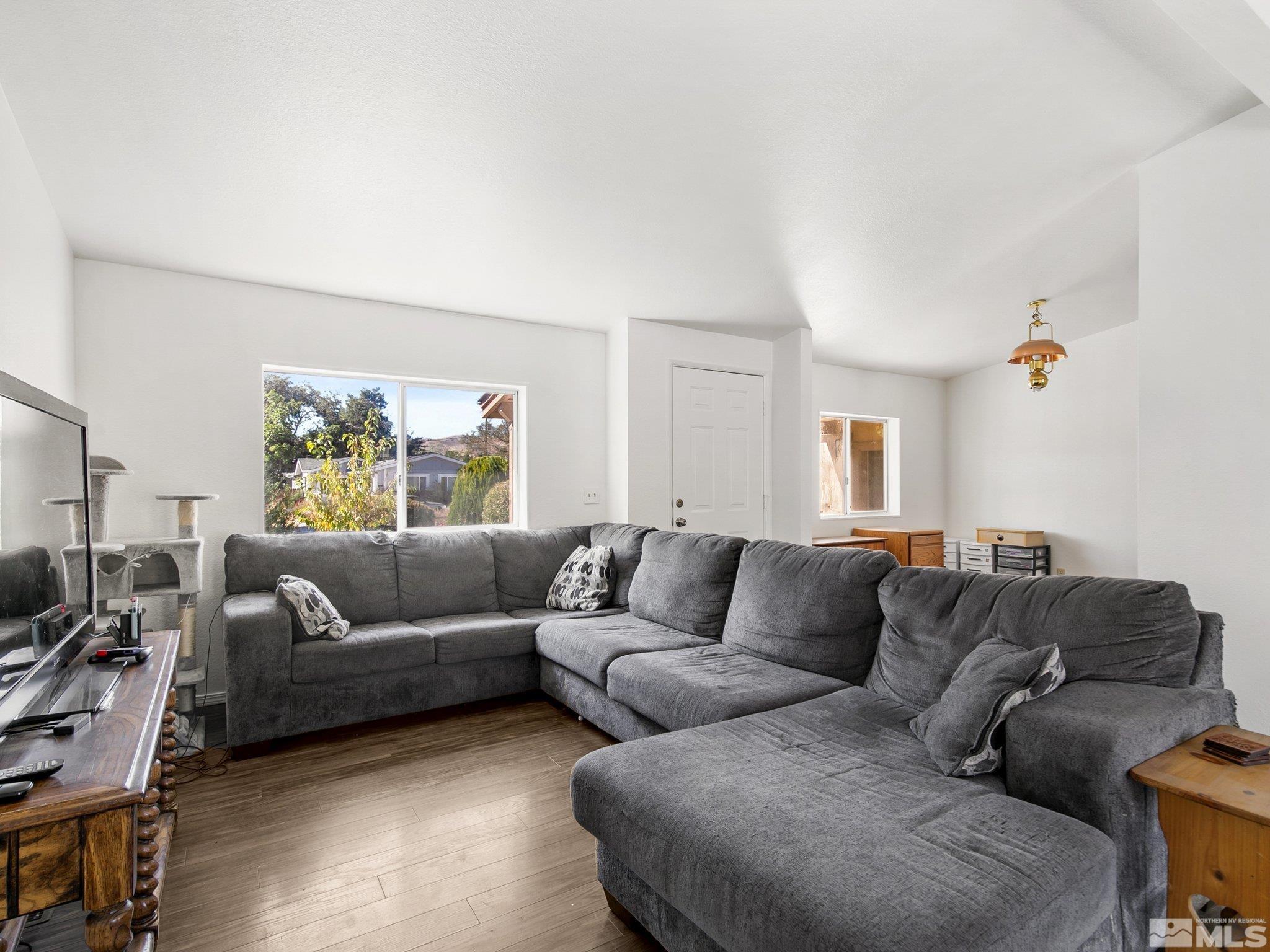 17280 Whippoorwill Lane Reno, NV 89508 - Photo 3 of 26 a living room with furniture and a couch
