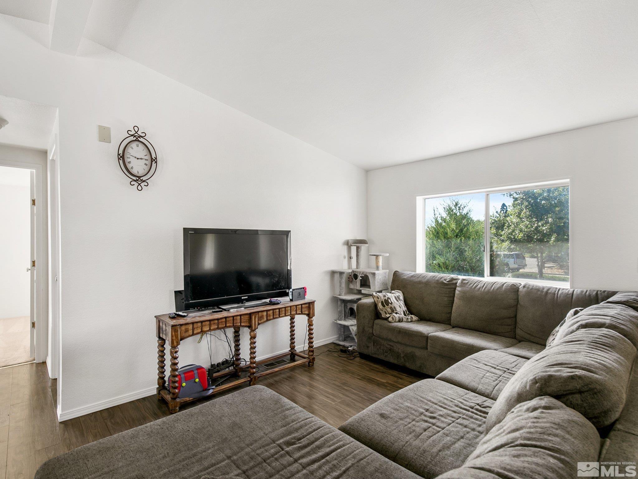 17280 Whippoorwill Lane Reno, NV 89508 - Photo 4 of 26 a living room with furniture and a flat screen tv