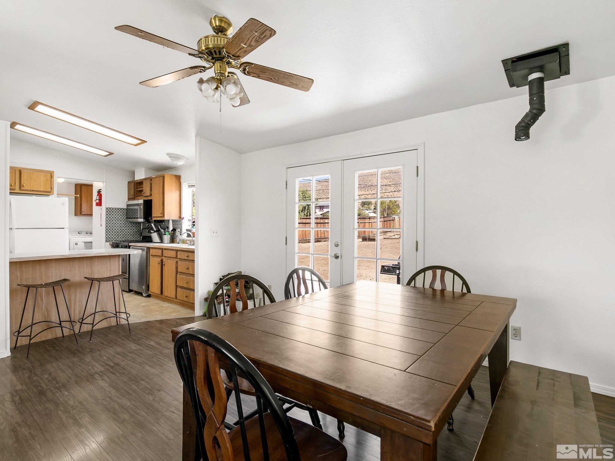 17280 Whippoorwill Lane Reno, NV 89508 - Photo 5 of 26 a view of a dining room with furniture and wooden floor