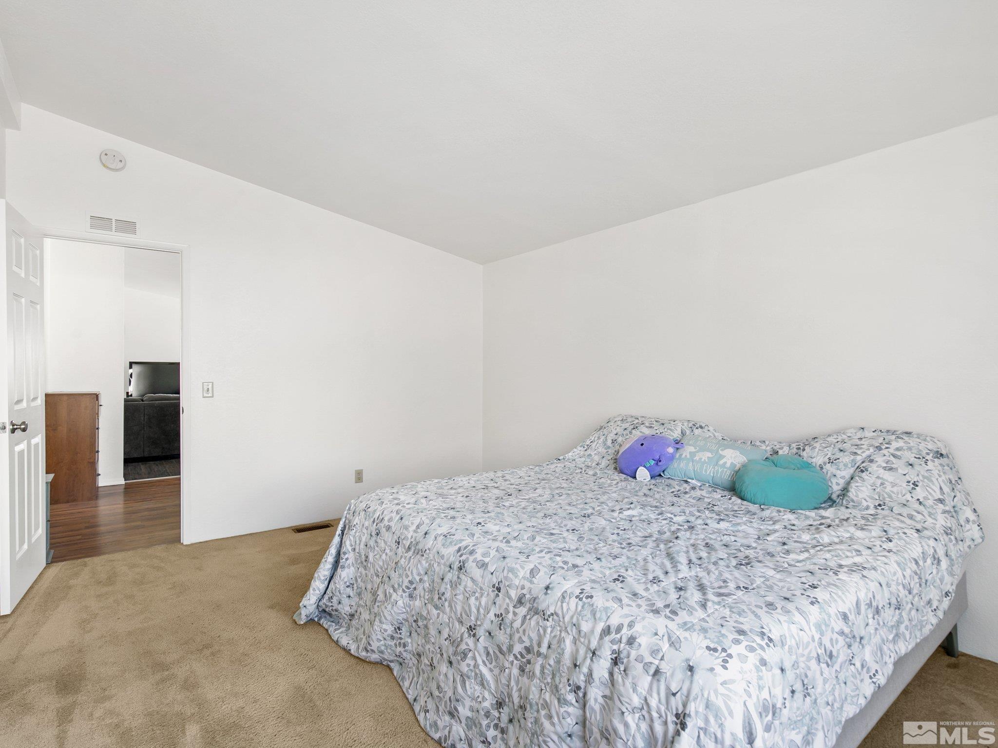 17280 Whippoorwill Lane Reno, NV 89508 - Photo 7 of 26 a bedroom with a bed and dresser