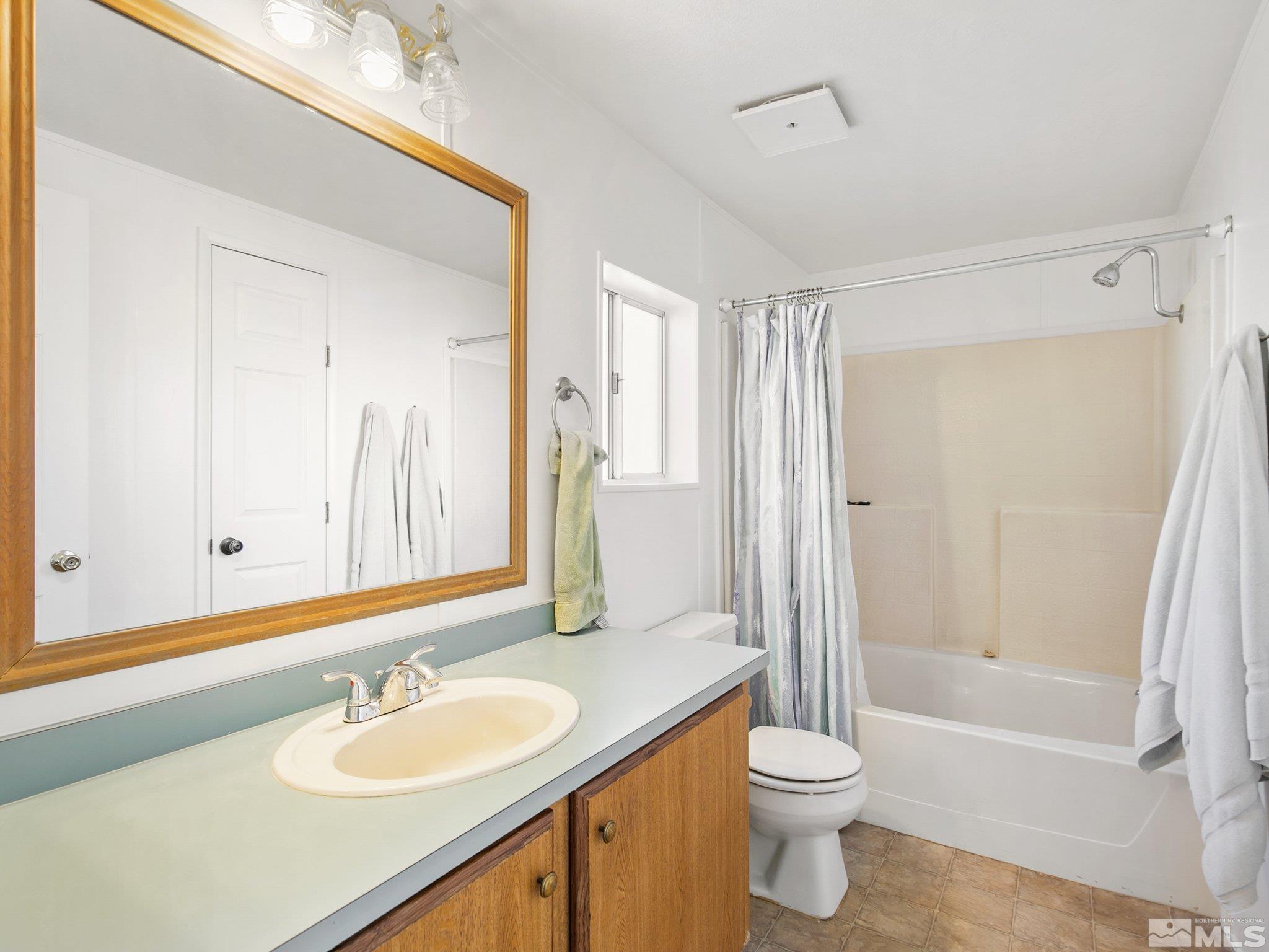 17280 Whippoorwill Lane Reno, NV 89508 - Photo 8 of 26 a bathroom with a sink a toilet and shower