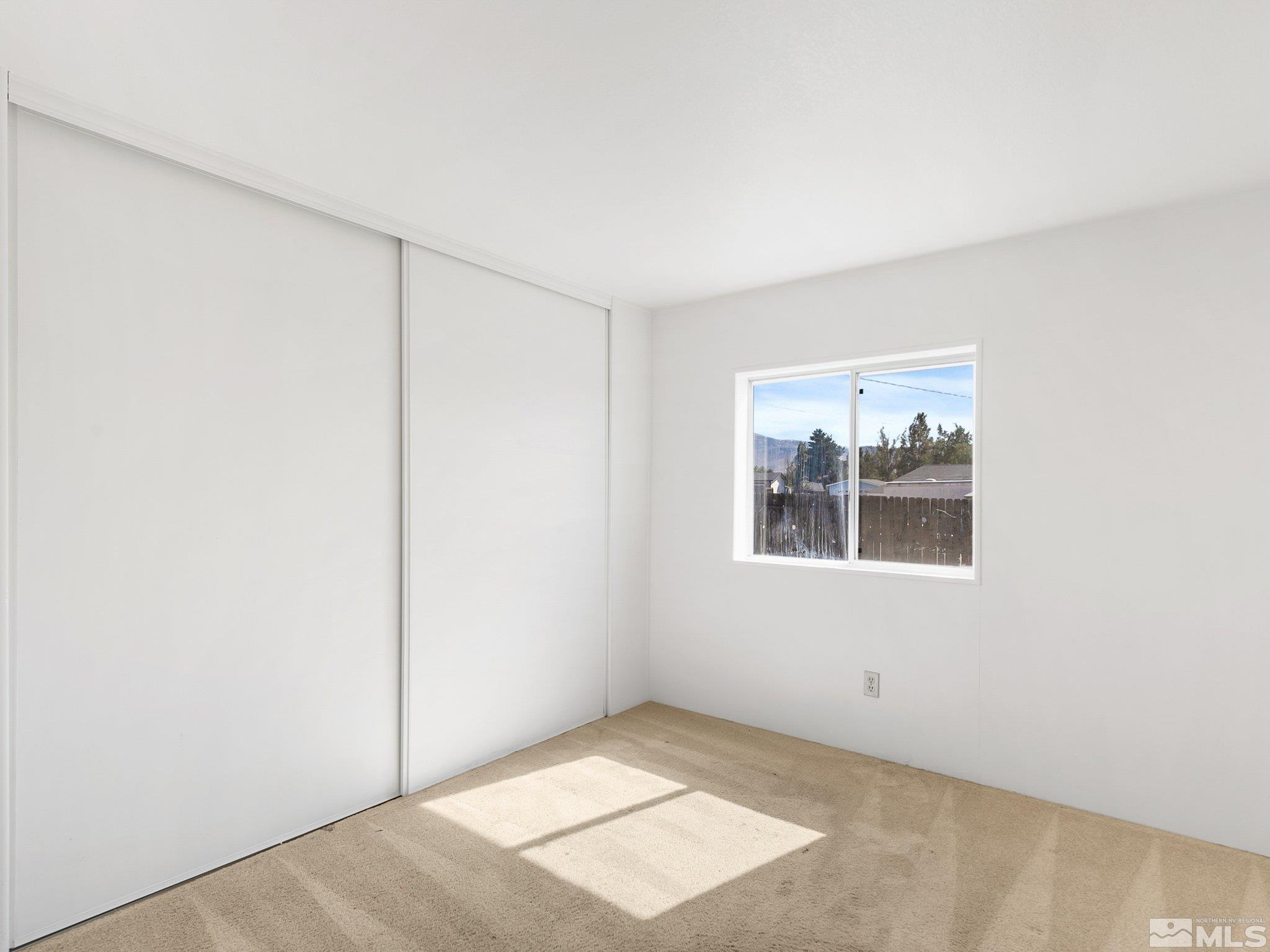17280 Whippoorwill Lane Reno, NV 89508 - Photo 9 of 26 an empty room with windows
