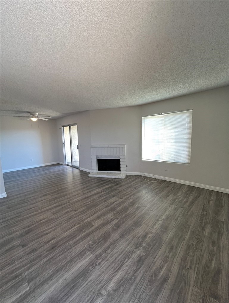 1025 North Tippecanoe, Unit 151 San Bernardino, CA 92410 - Photo 4 of 11 a view of an empty room with wooden floor and a window
