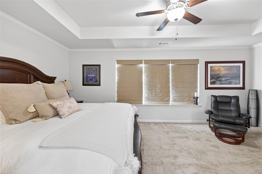 286 Turtle Creek Drive Winder, GA 30680 - Photo 20 of 39 a bedroom with a bed and a fireplace