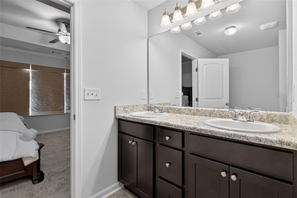 286 Turtle Creek Drive Winder, GA 30680 - Photo 25 of 39 a bathroom with a sink vanity and a mirror