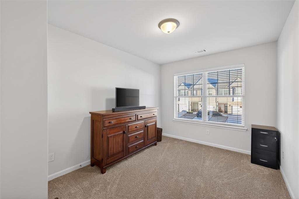 286 Turtle Creek Drive Winder, GA 30680 - Photo 28 of 39 a room with furniture and flat screen tv