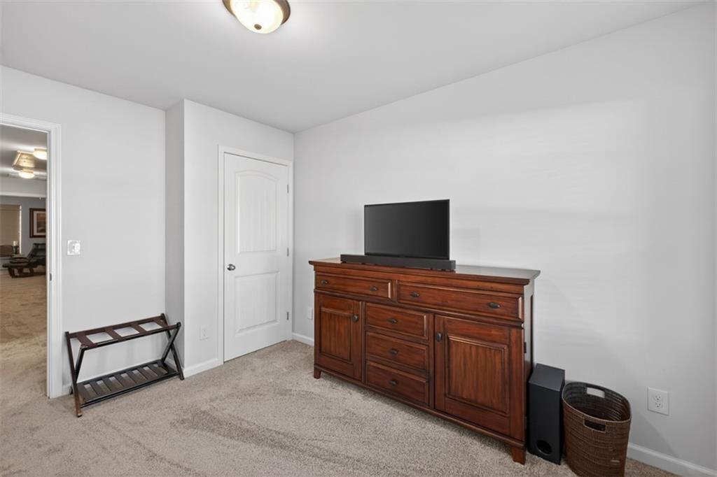 286 Turtle Creek Drive Winder, GA 30680 - Photo 29 of 39 a room with a dresser and a television