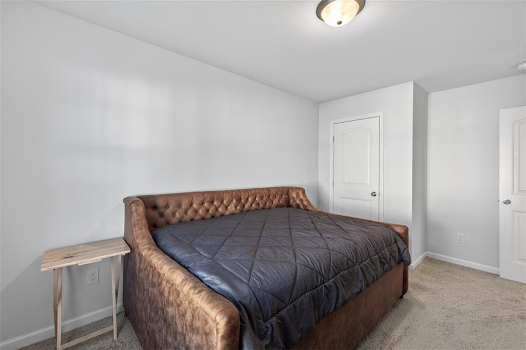 286 Turtle Creek Drive Winder, GA 30680 - Photo 31 of 39 a bedroom with a bed and a window