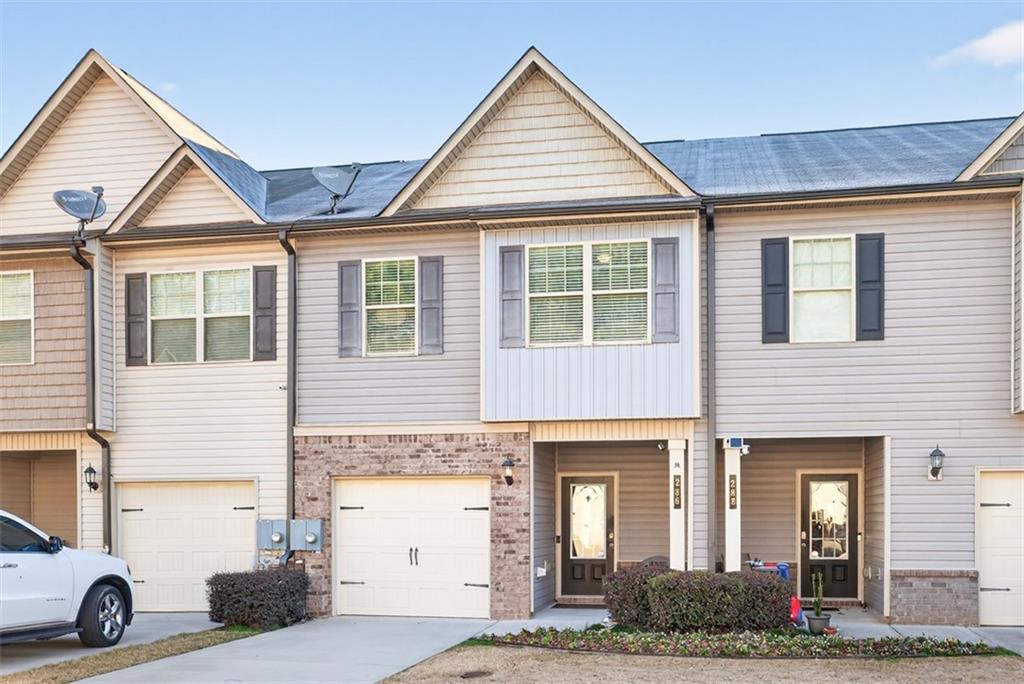 286 Turtle Creek Drive Winder, GA 30680 - Photo 4 of 39 a view of a house with more windows and refrigerator