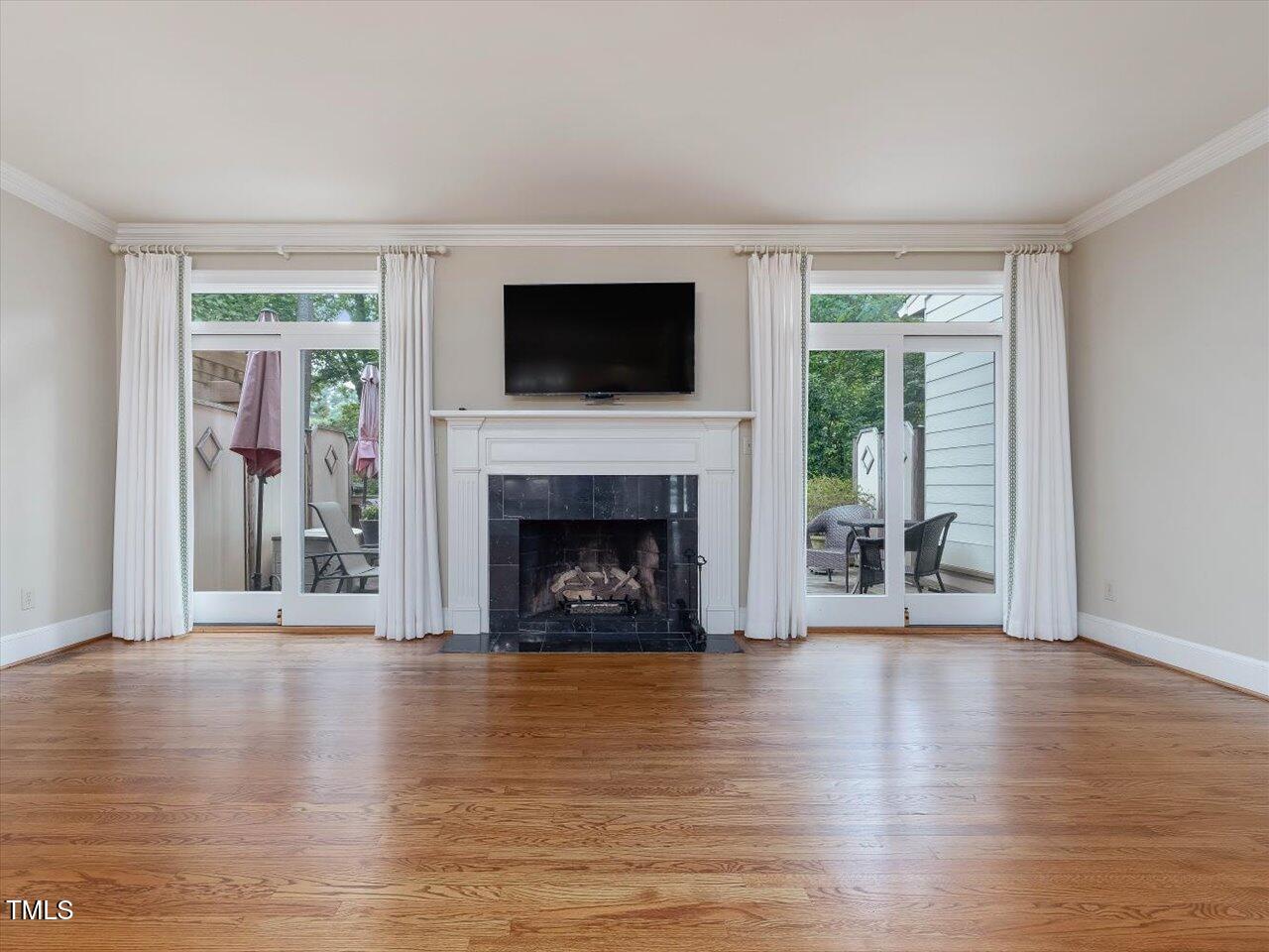 3347 Ridgecrest Court Raleigh, NC 27607 - Photo 23 of 65 a living room with furniture and a fireplace