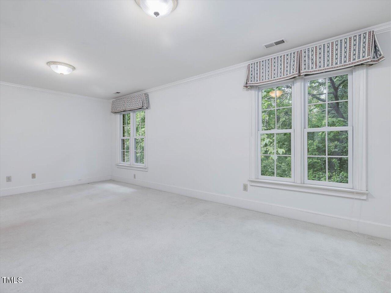 3347 Ridgecrest Court Raleigh, NC 27607 - Photo 56 of 65 an empty room with windows