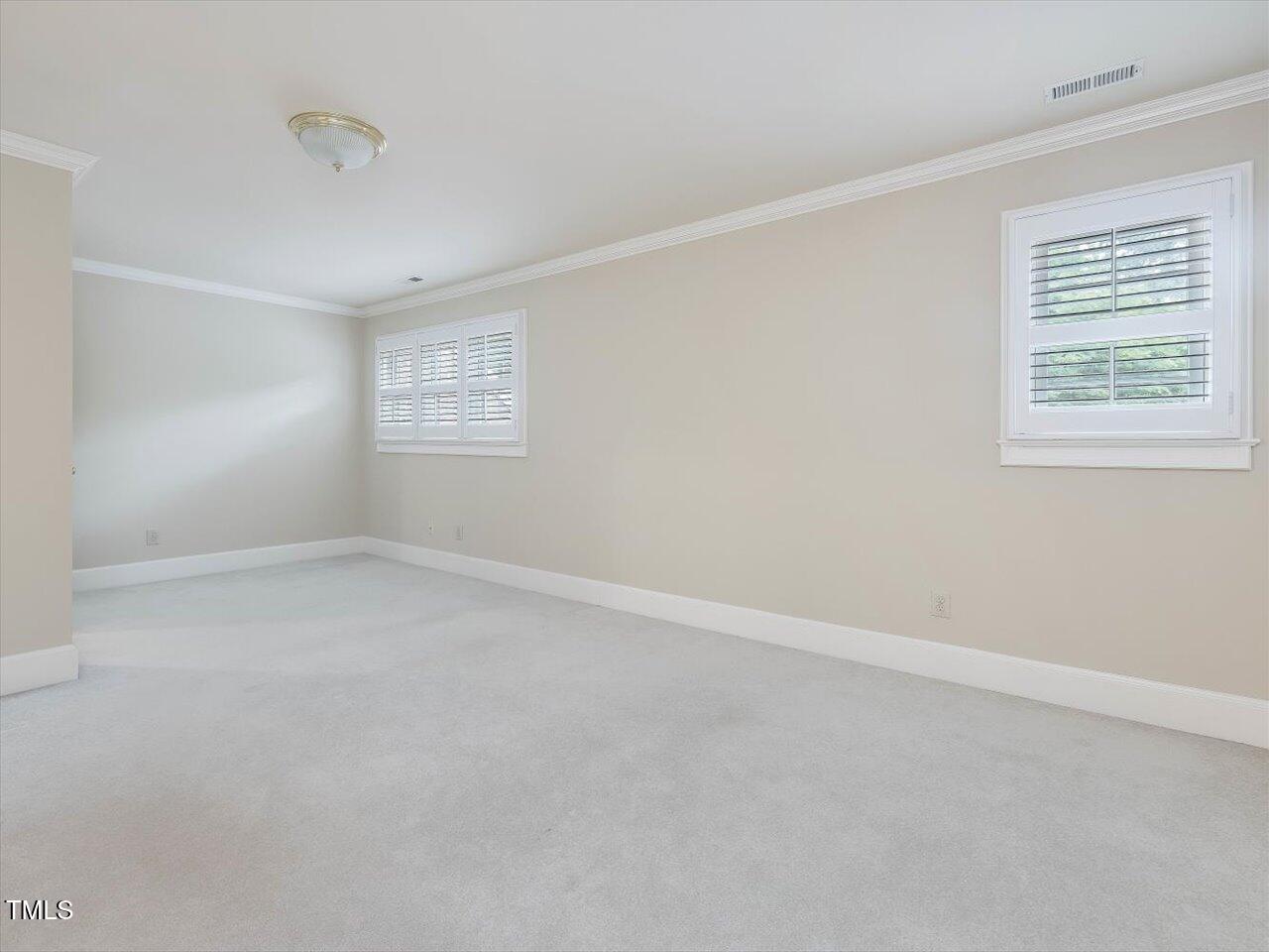 3347 Ridgecrest Court Raleigh, NC 27607 - Photo 57 of 65 an empty room with a window