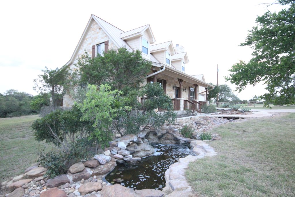 5255 Lookout Ridge Drive Marble Falls, TX 78654 - Photo 36 of 40 Flowing fountain and walkway beside front covered porch