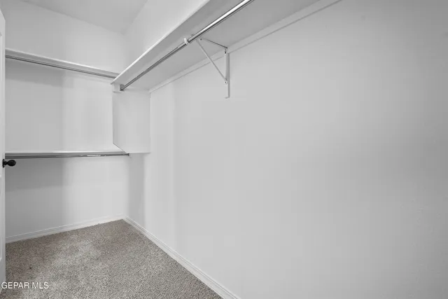 a view of an empty walk in closet