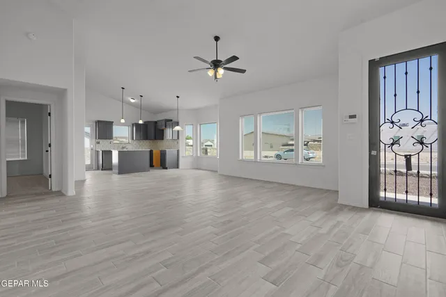 a view of a kitchen with a sink and a window