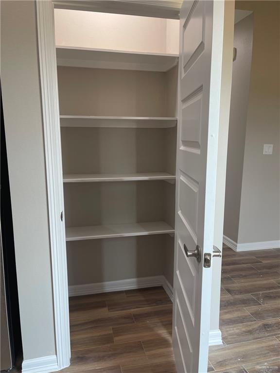 605 Sparrow Road Weslaco, TX 78596 - Photo 12 of 31 a view of walk in closet with empty racks